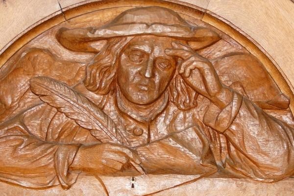 Ratsschreiber: Detail der geschnitzen Holztür zum Ratssaal